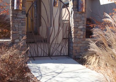 Curved artistic flow entryway gate